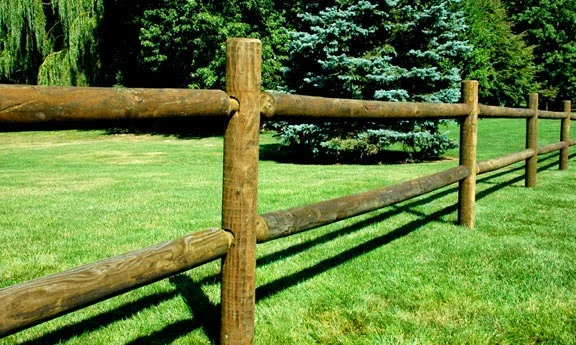 green grass with split rail fence